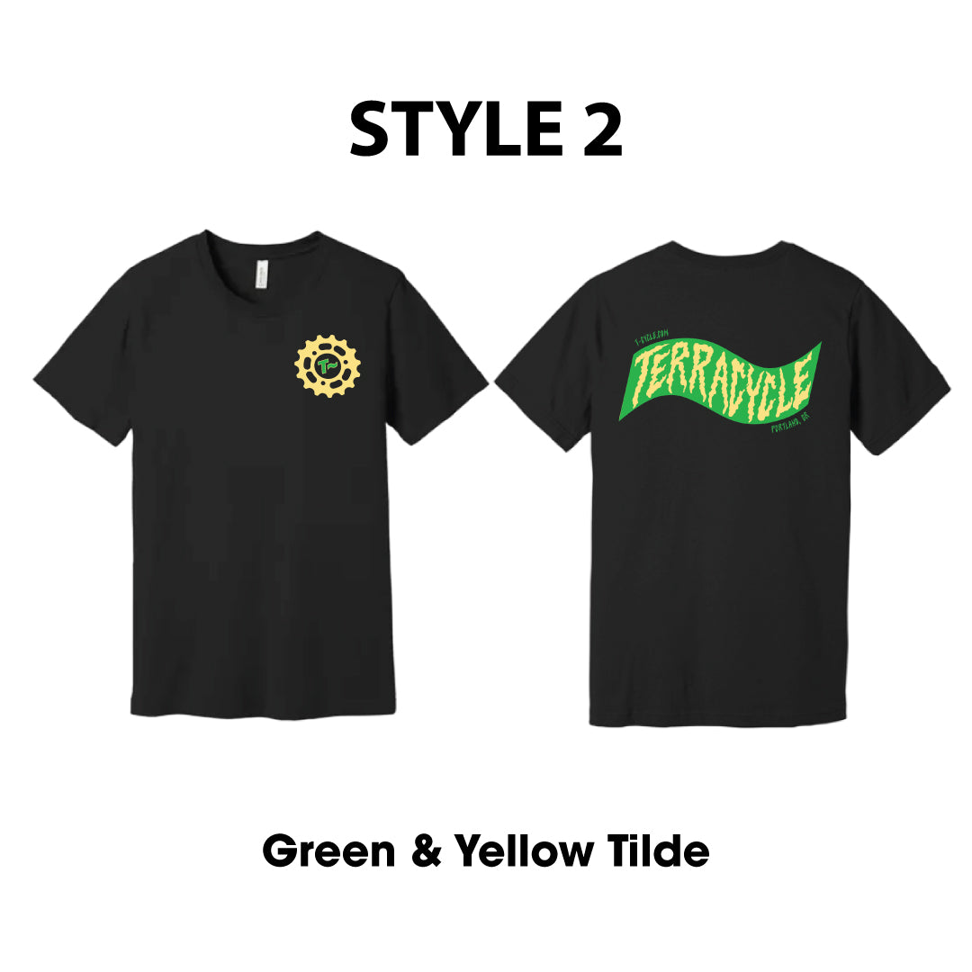 Front and back of black short-sleeve T-shirt shown on a white background, labeled STYLE 2. The left front side shows a small yellow circular gear logo on the chest, and the right back side of the shirt shows a yellow and green wavy 'TERRACYCLE' graphic.