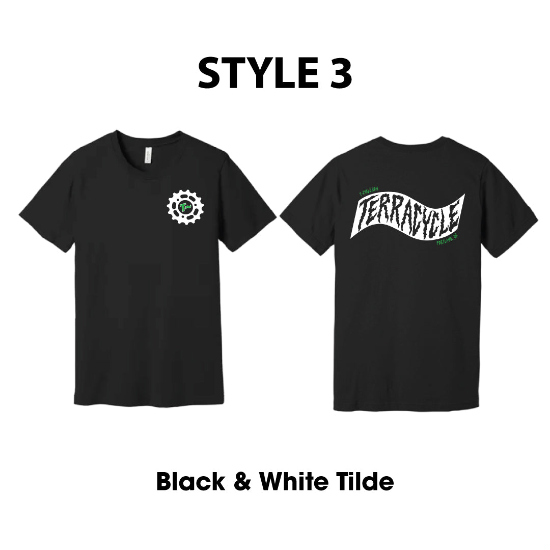 Front and back of black short-sleeve T-shirt shown on a white background, labeled STYLE 2. The left front side shows a small white circular gear logo on the chest, and the right back side of the shirt shows a black and white wavy 'TERRACYCLE' graphic.